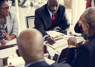 Image of business associates around a table.
